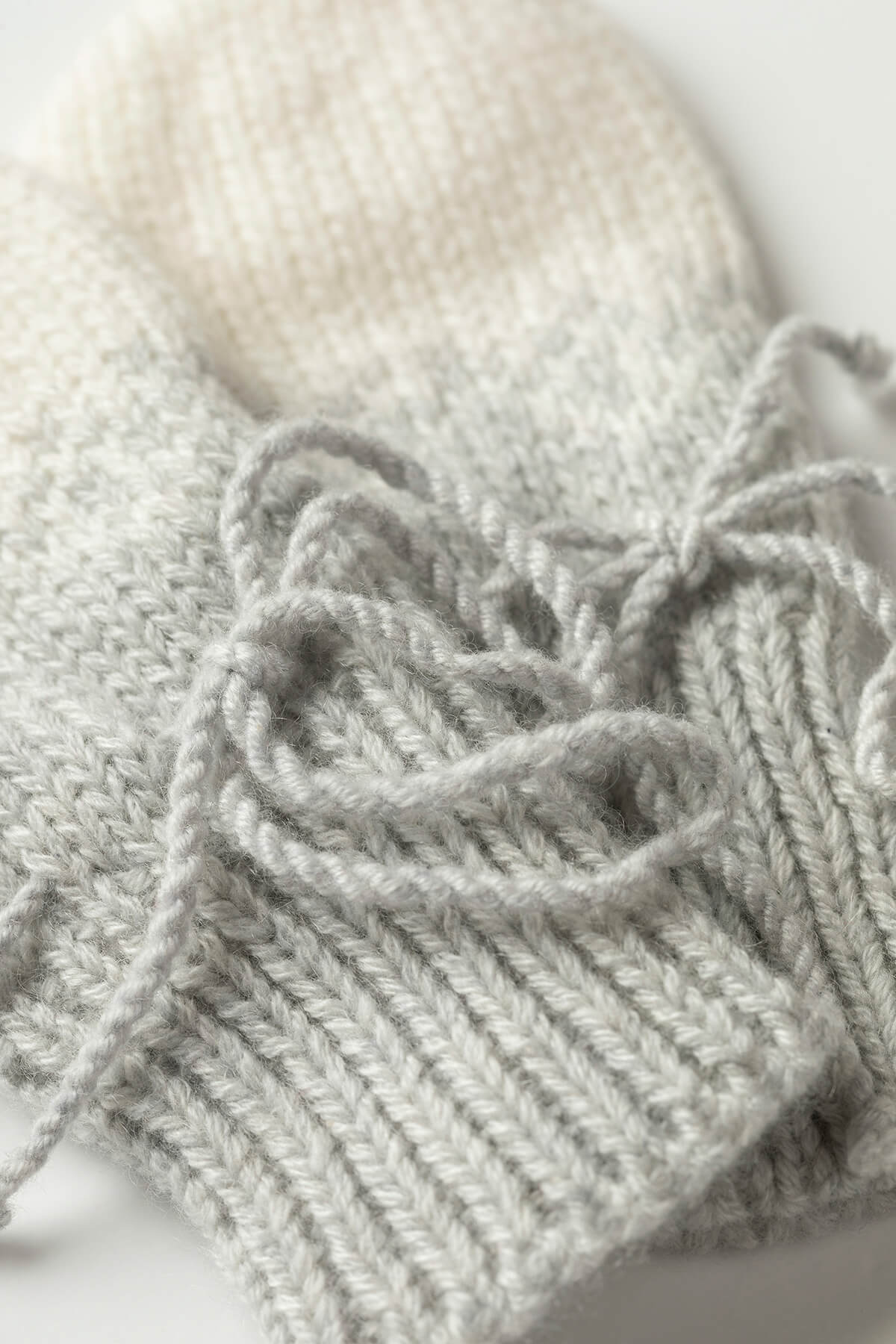 Johnstons of Elgin Hand Knitted Ombre Cashmere Baby Mittens in Pumice JA000118HA0090