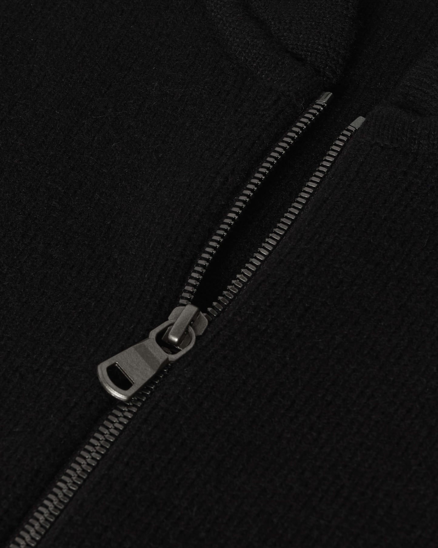 Johnstons of Elgin AW25 Men's Knitwear Black Cashmere Milano Stitch Zip Jacket with black trousers and a white t-shirt KAA05443SA0900