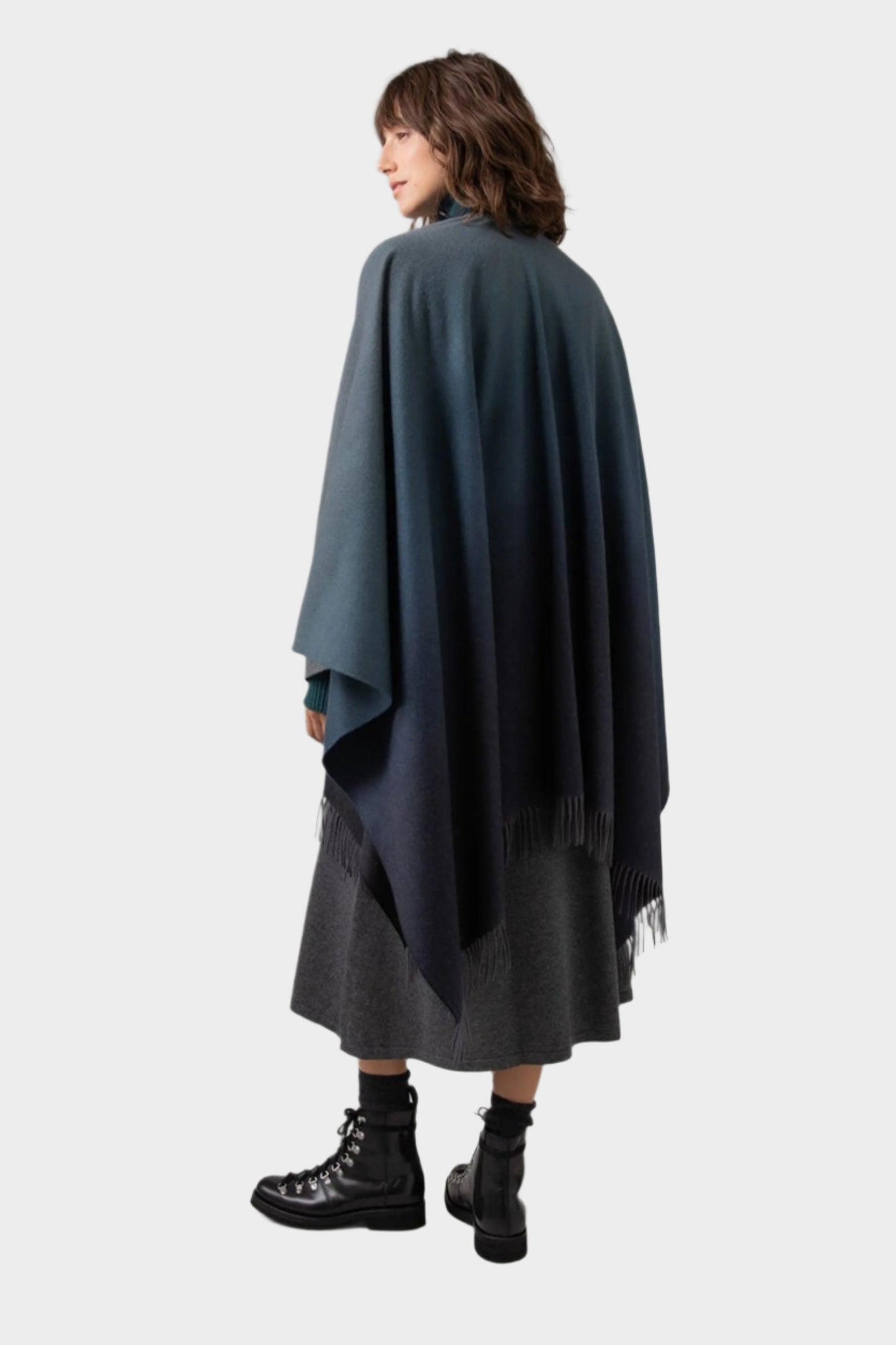 Johnstons of Elgin Ombre Cape in Navy & Back worn by model against a grey background TA000360RU7302ONE