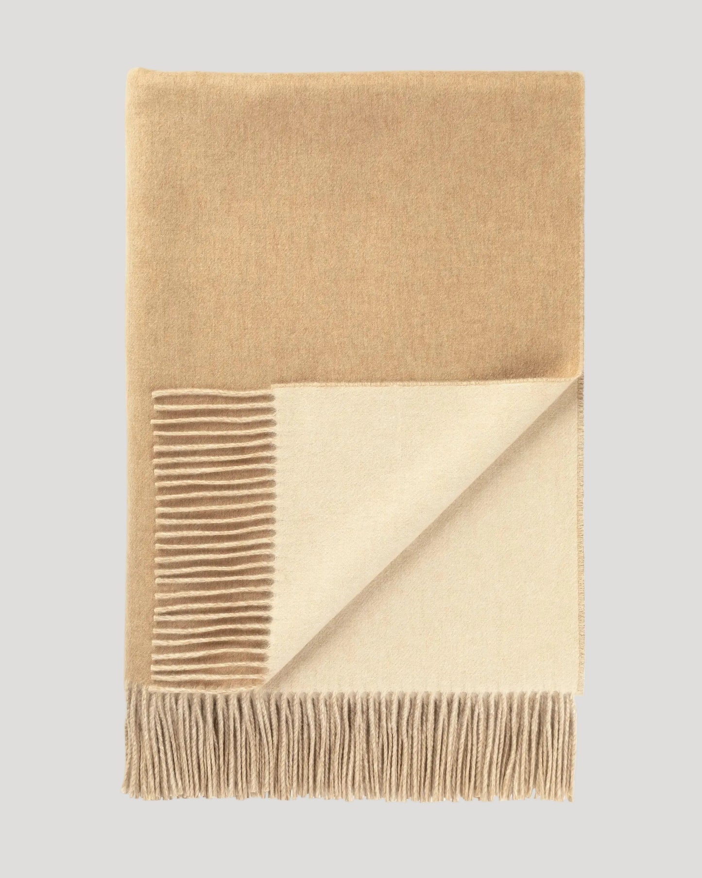 Johnstons of Elgin Interiors Collection Blonde & White Reversible Cashmere Throw on a white background WA000013RU7432ONE