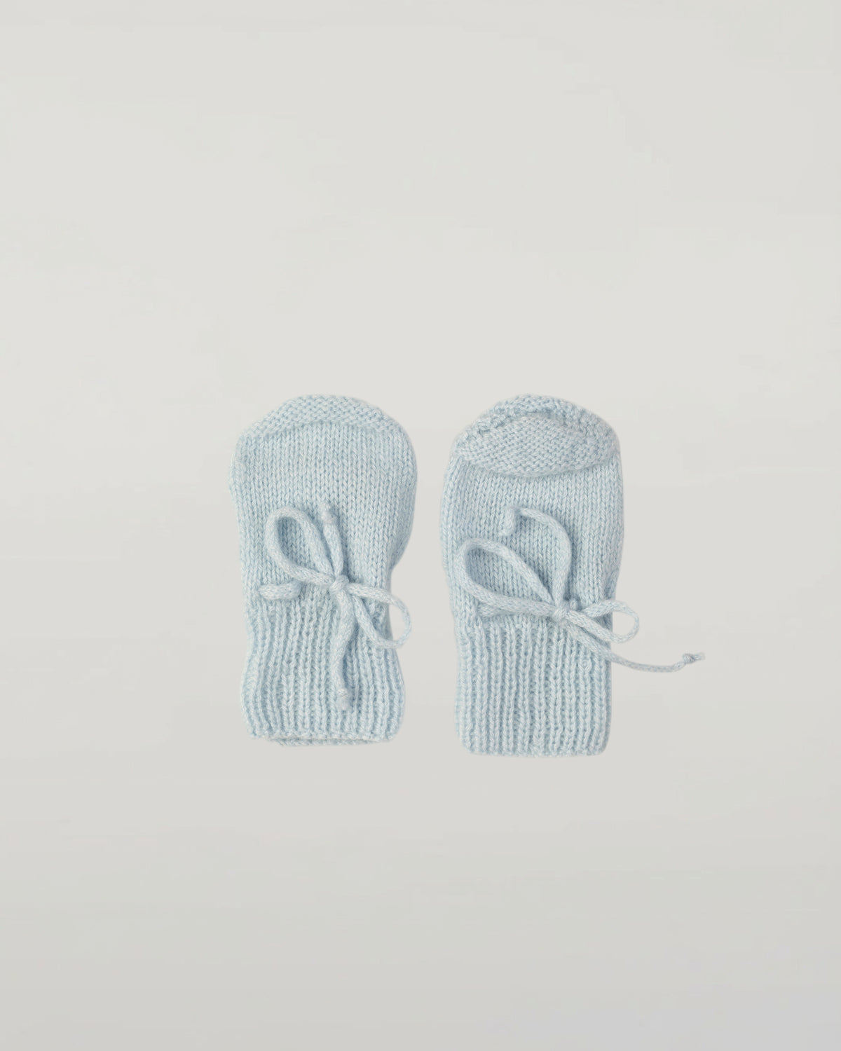 Johnstons of Elgin Hand Knitted Cashmere Baby Mittens in Powder Blue on white background JA000108SD0167ONE