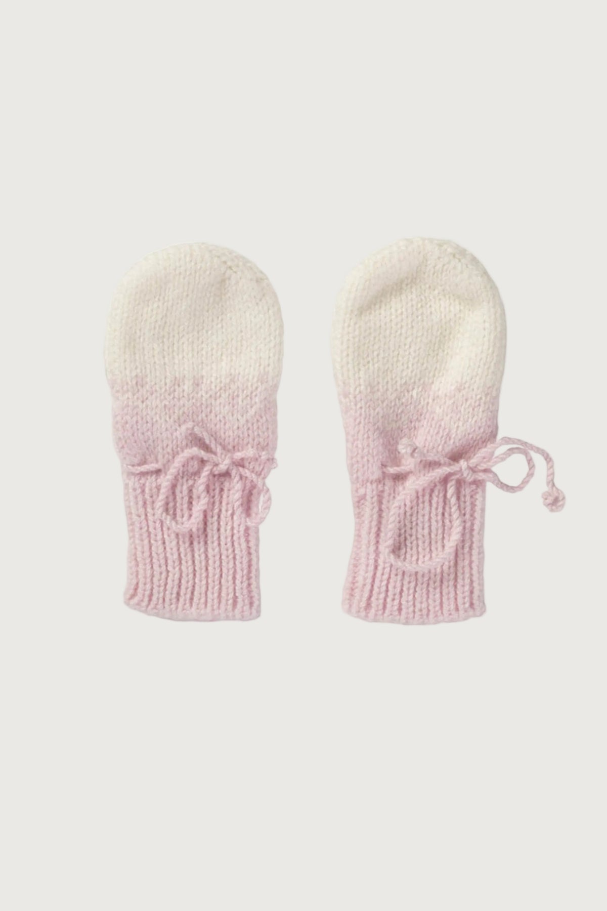 Johnstons of Elgin Hand Knitted Ombre Cashmere Baby Mittens in Blush on a white background JA000118SE0208