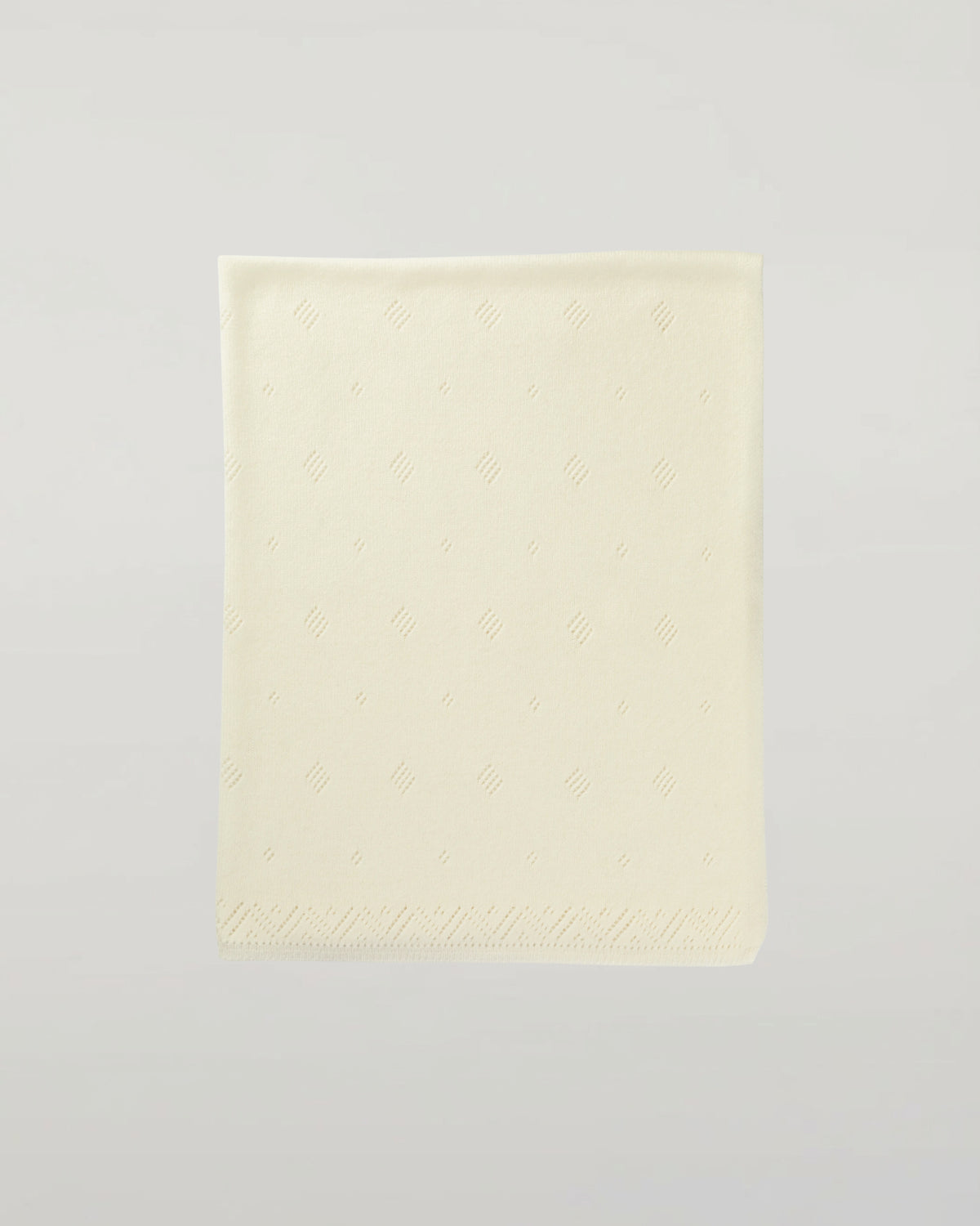 Johnstons of Elgin’s Gift Set includes our Cashmere Pointelle Baby Blanket, Hat, Mittens & Booties in Ecru on a white background AW21GIFTSET18A