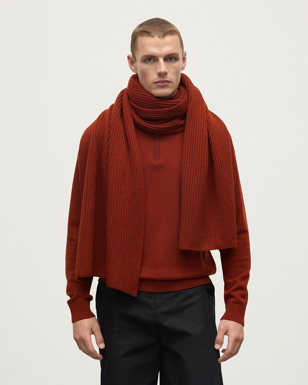 Model wearing Johnstons of Elgin AW25 Knitted Accessories Oxblood Cardigan Stitch Red Cashmere Scarf HAC03538SG4463ONE