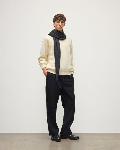 MALE MODEL WEARING JOHNSTONS OF ELGIN CASHMERE GAUZY ETHEL DIAMOND SCARF BLACK & GREY 100% CASHMERE OVER CREAM CASHMERE SWEATER HAE03401Q26237ONE