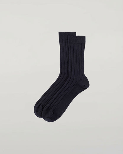 Johnstons of Elgin set of three pairs of cashmere socks in grey, navy, and beige on a light grey background 2025GIFTSET2