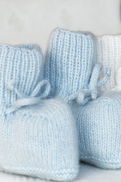 Johnstons of Elgin Hand Knitted Cashmere Baby Booties in Powder Blue on white JA000114SD0167ONE