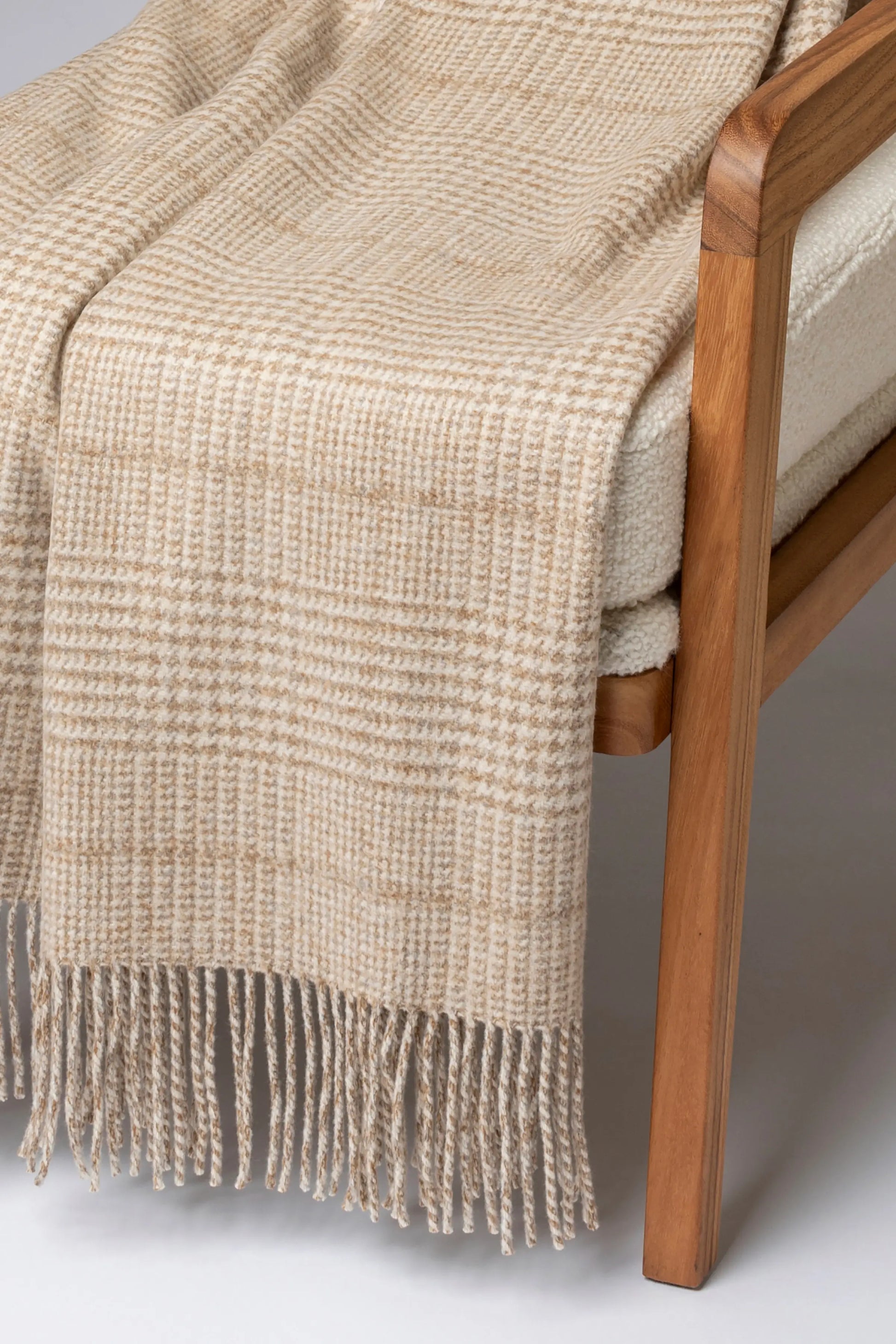 2025 Johnstons of Elgin Interiors Collection Natural Tweed Glen Check Wool Throw on a grey background  WDC01930RU7651ONE