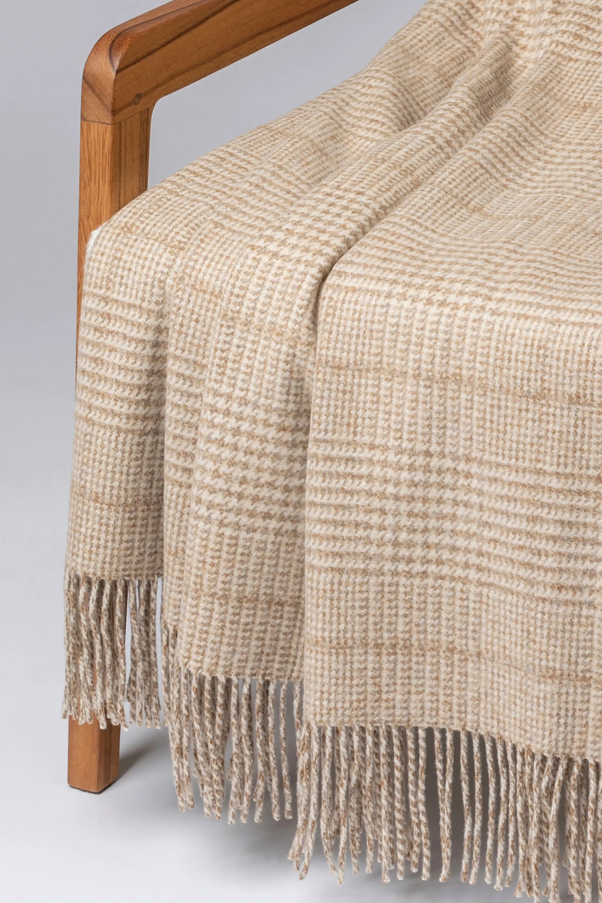 2025 Johnstons of Elgin Interiors Collection Natural Tweed Glen Check Wool Throw on a grey background  WDC01930RU7651ONE