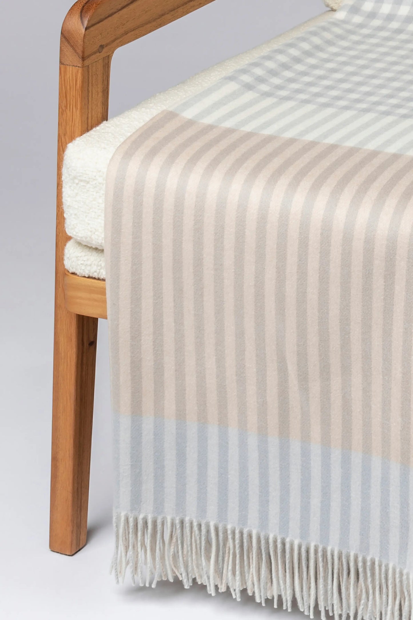2025 Johnstons of Elgin Interiors Collection Heron Check Reversible Cashmere Throw on a grey background  WA000013RU7604ONE