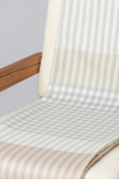 2025 Johnstons of Elgin Interiors Collection Heron Check Reversible Cashmere Throw on a grey background  WA000013RU7604ONE