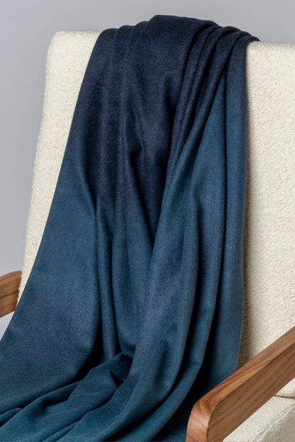 2025 Johnstons of Elgin Interiors Collection Seascape & Navy Ombré Cashmere Throw on a grey background  WA000055RU7686ONE
