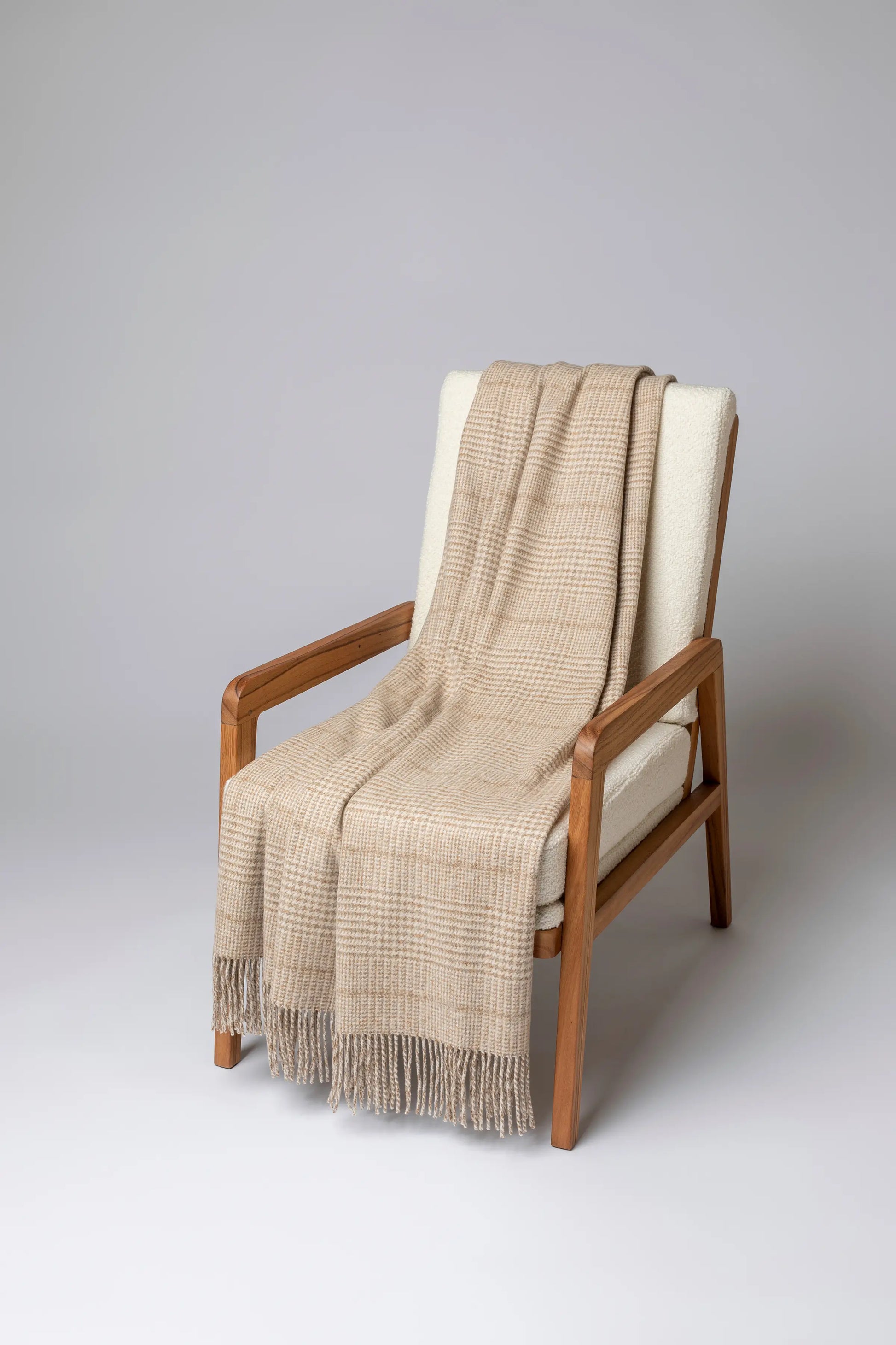 2025 Johnstons of Elgin Interiors Collection Natural Tweed Glen Check Wool Throw on a grey background  WDC01930RU7651ONE