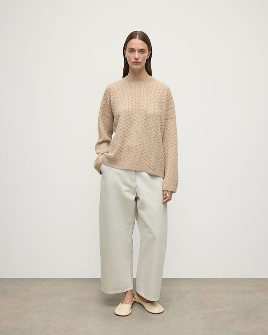 Model wearing Johnstons of Elgin Women's Knitwear Oatmeal Slouchy Cable Natural Cashmere Jumper Front View KAA05282HB0210