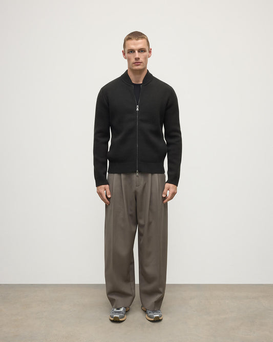 Front view model wearing Johnstons of Elgin AW25 Men's Knitwear Black Milano Ribbed Zip Black Cashmere Cardigan KAA05443SC7330