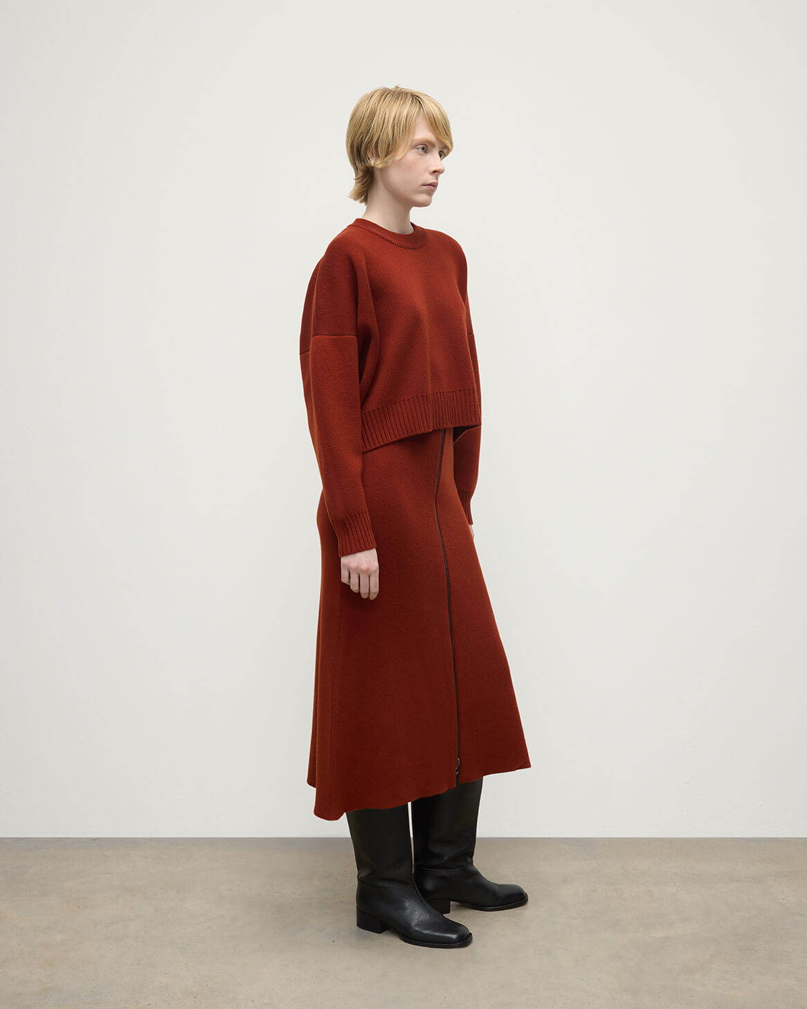 Model wearing Johnstons of Elgin AW25 Women's Knitwear Oxblood Cropped Milano Red Cashmere Jumper Side View KAA05488SG4463
