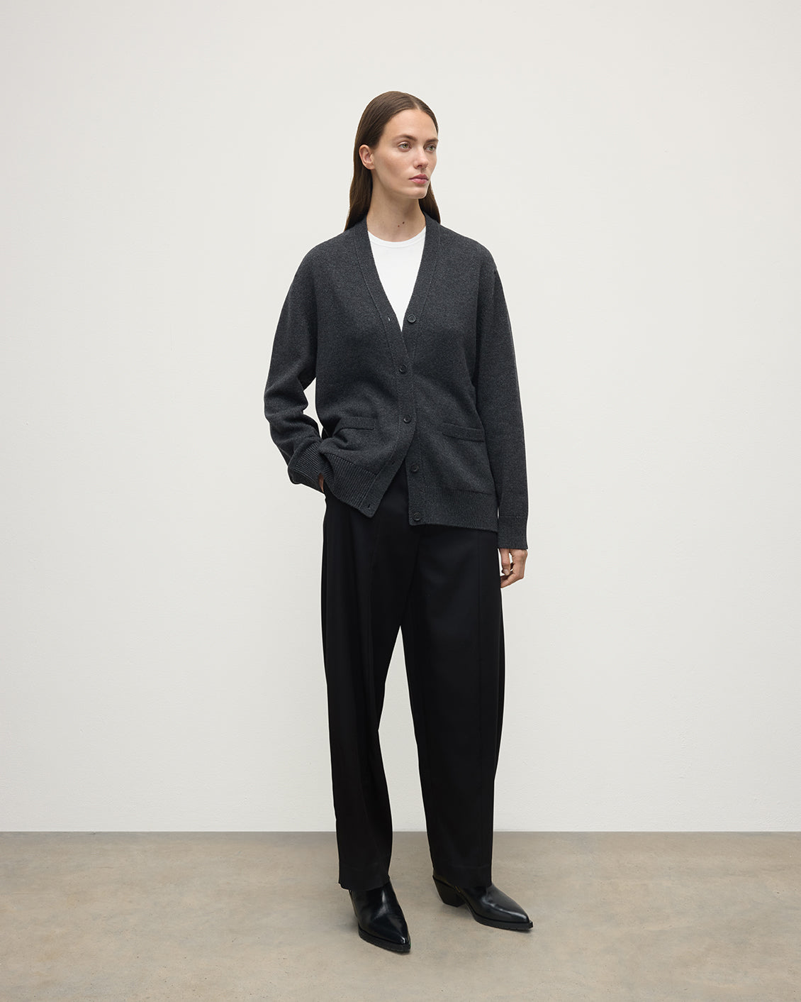 Model wearing Johnstons of Elgin AW25 Women's Knitwear Charcoal Boyfriend-Fit Grey Cashmere Cardigan Side View KAA05560HA7165