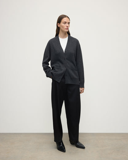 Model wearing Johnstons of Elgin AW25 Women's Knitwear Charcoal Boyfriend-Fit Grey Cashmere Cardigan Side View KAA05560HA7165