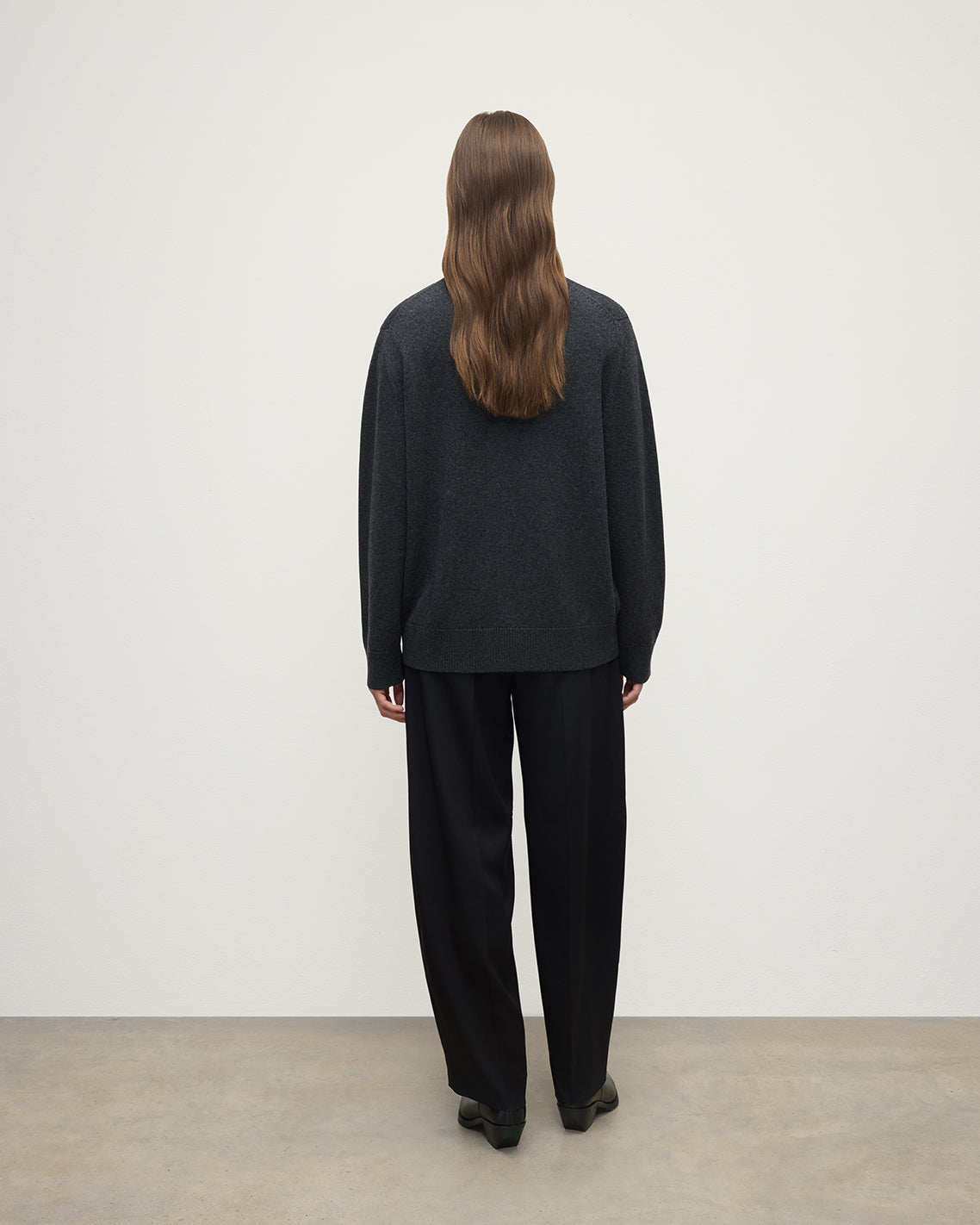 Model wearing Johnstons of Elgin AW25 Women's Knitwear Charcoal Boyfriend-Fit Grey Cashmere Cardigan Back View KAA05560HA7165