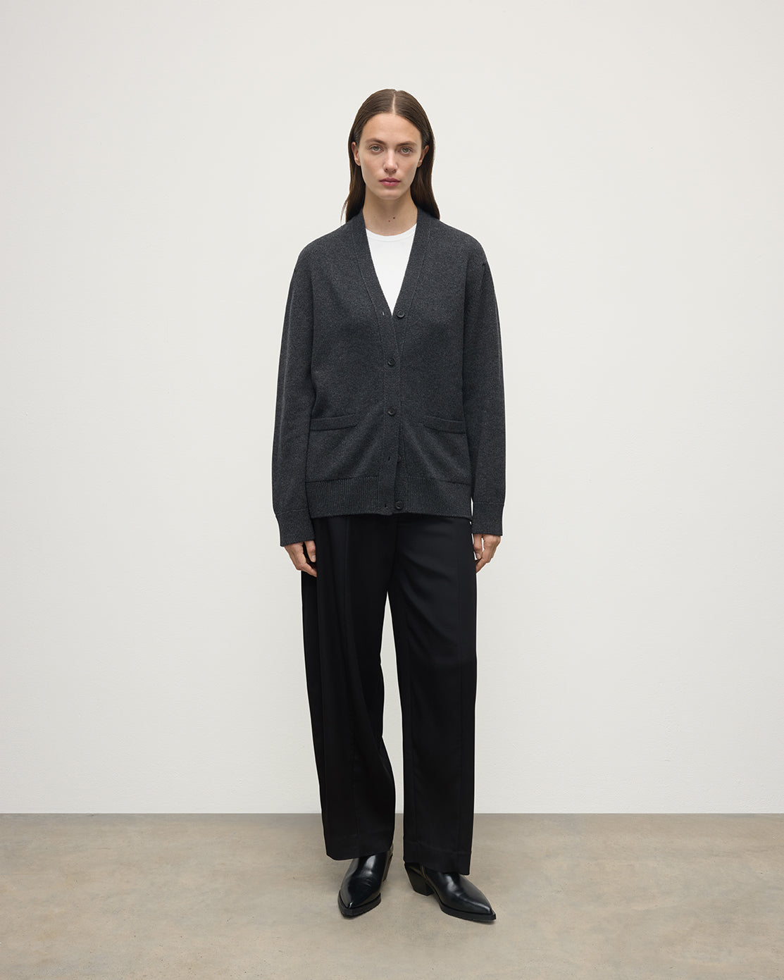Model wearing Johnstons of Elgin AW25 Women's Knitwear Charcoal Boyfriend-Fit Grey Cashmere Cardigan Front View KAA05560HA7165