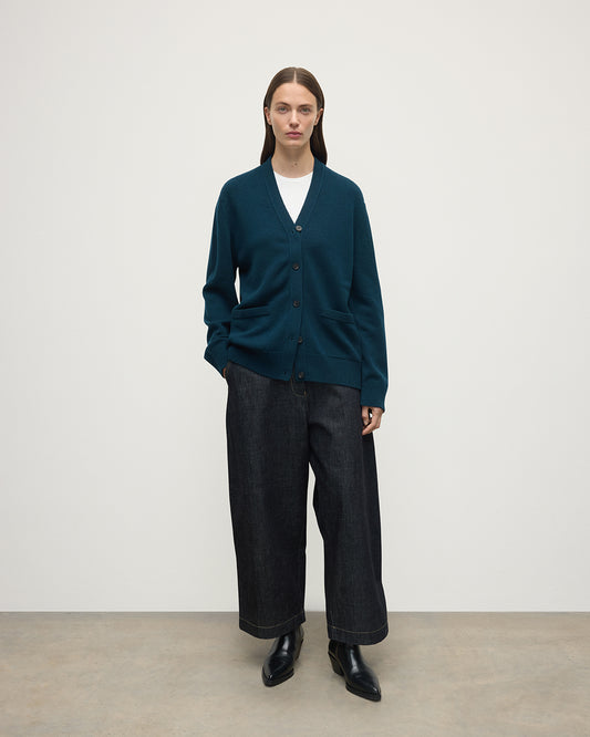 Model wears Johnstons of Elgin AW25 Women's Knitwear Bottle Green Boyfriend-Fit Green Cashmere Cardigan  Front View KAA05560SC7341