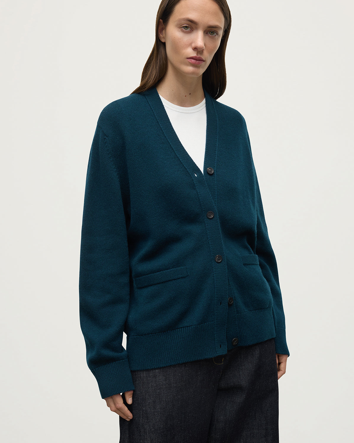 Model wears Johnstons of Elgin AW25 Women's Knitwear Bottle Green Boyfriend-Fit Green Cashmere Cardigan  close up KAA05560SC7341