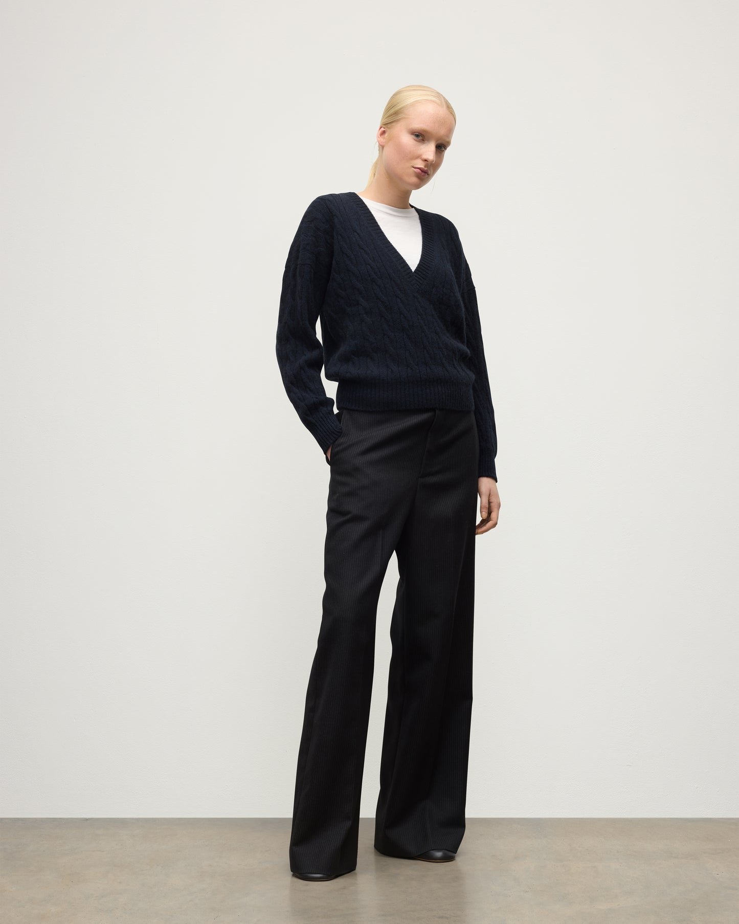 WOMENS KYLESKU DEEP VEE SWEATER NAVY ON A MODEL KAA05728HD7347