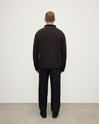 Back view of a model wearing Johnstons of Elgin AW25 Men's Knitwear Molasses Brown Cashmere Turtleneck Jumper KAB05484SB7290