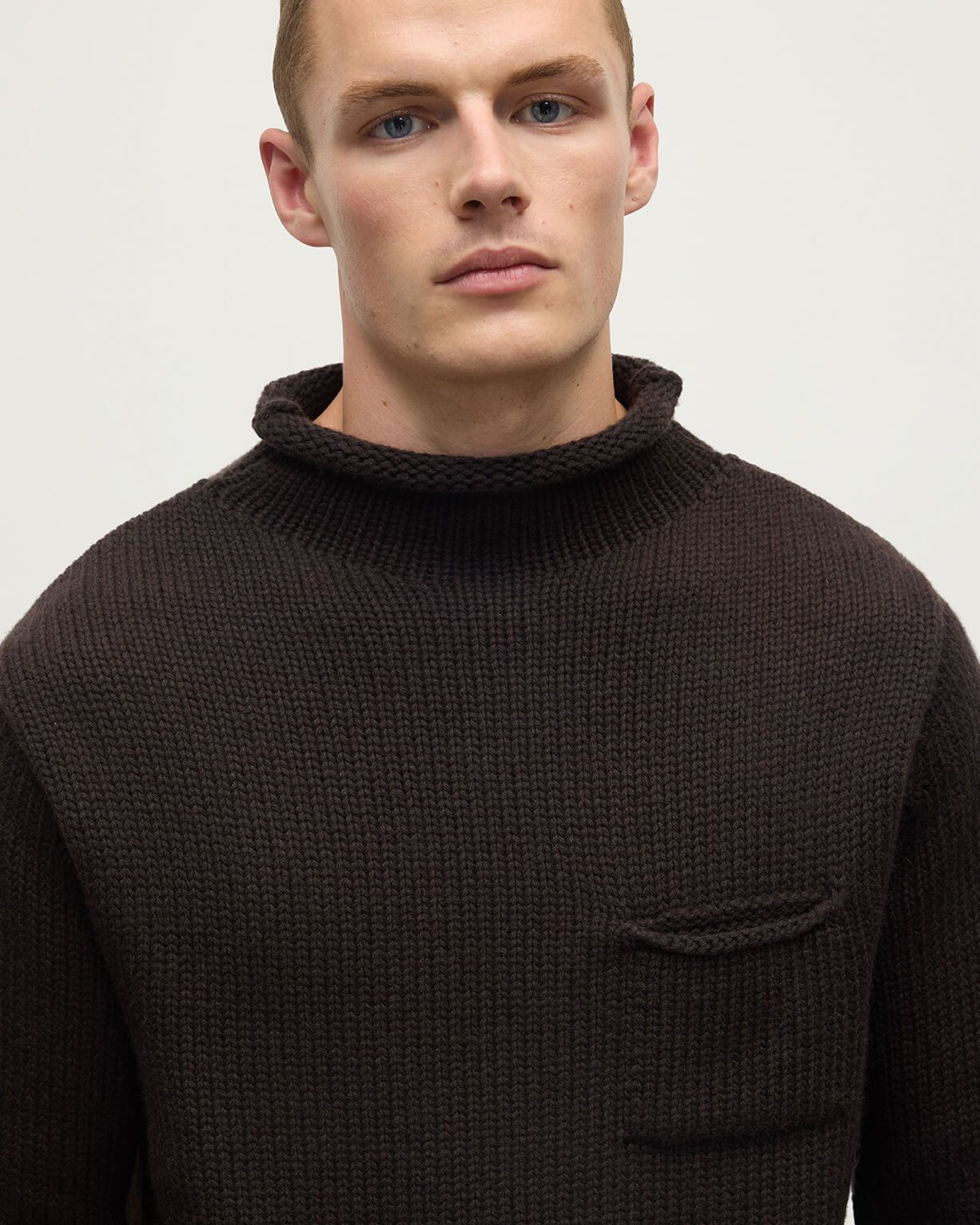 Details of a model wearing Johnstons of Elgin AW25 Men's Knitwear Molasses Brown Cashmere Turtleneck Jumper KAB05484SB7290