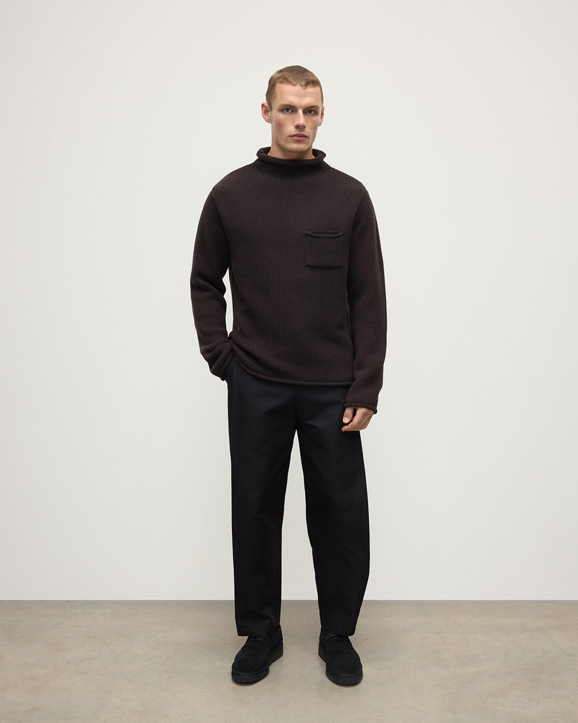 Front view of a model wearing Johnstons of Elgin AW25 Men's Knitwear Molasses Brown Cashmere Turtleneck Jumper KAB05484SB7290