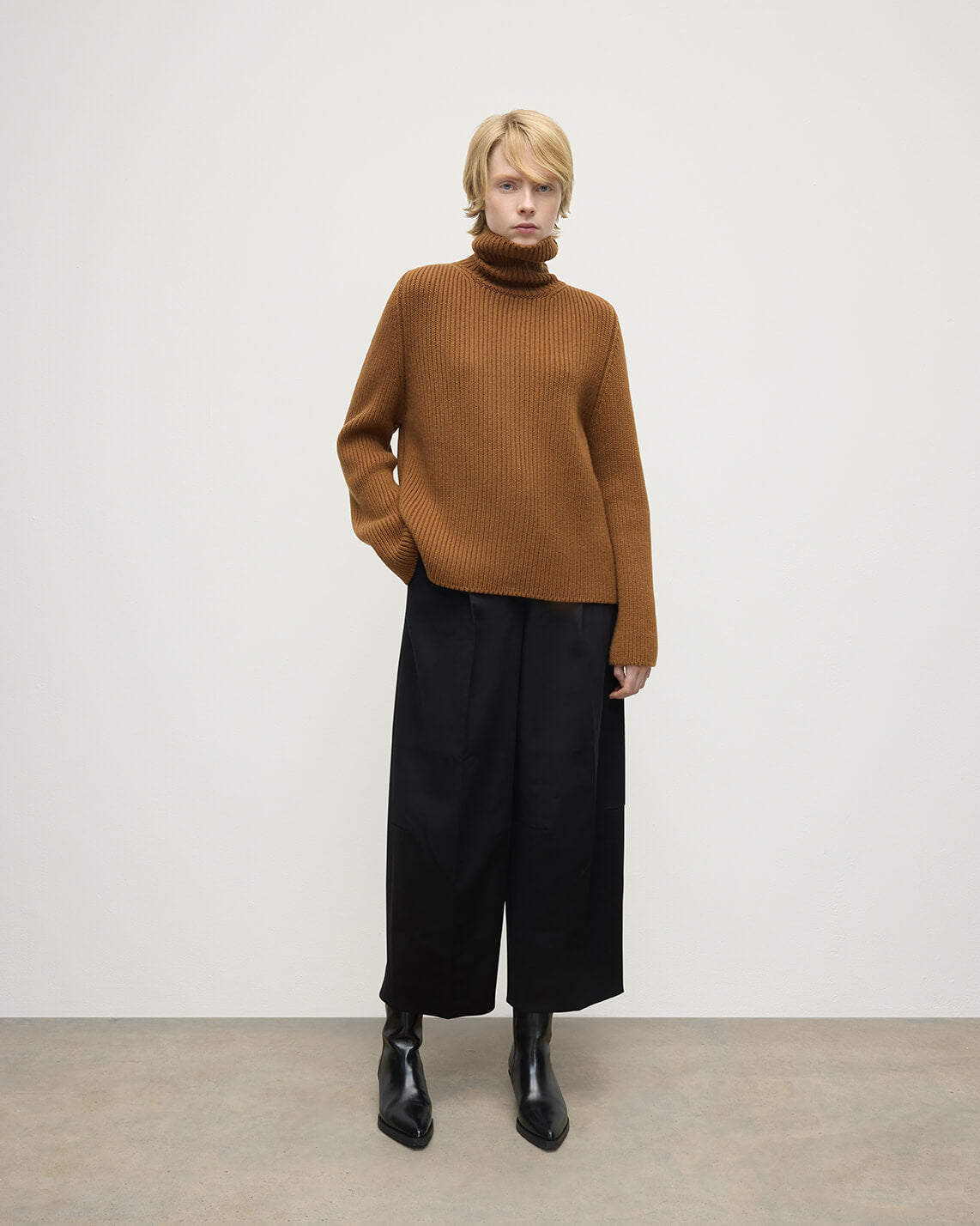 Model wearing Johnstons of Elgin AW25 Women's Knitwear Dark Camel Roll-Collar Camel Cashmere Jumper Front View KAB05492SB4620