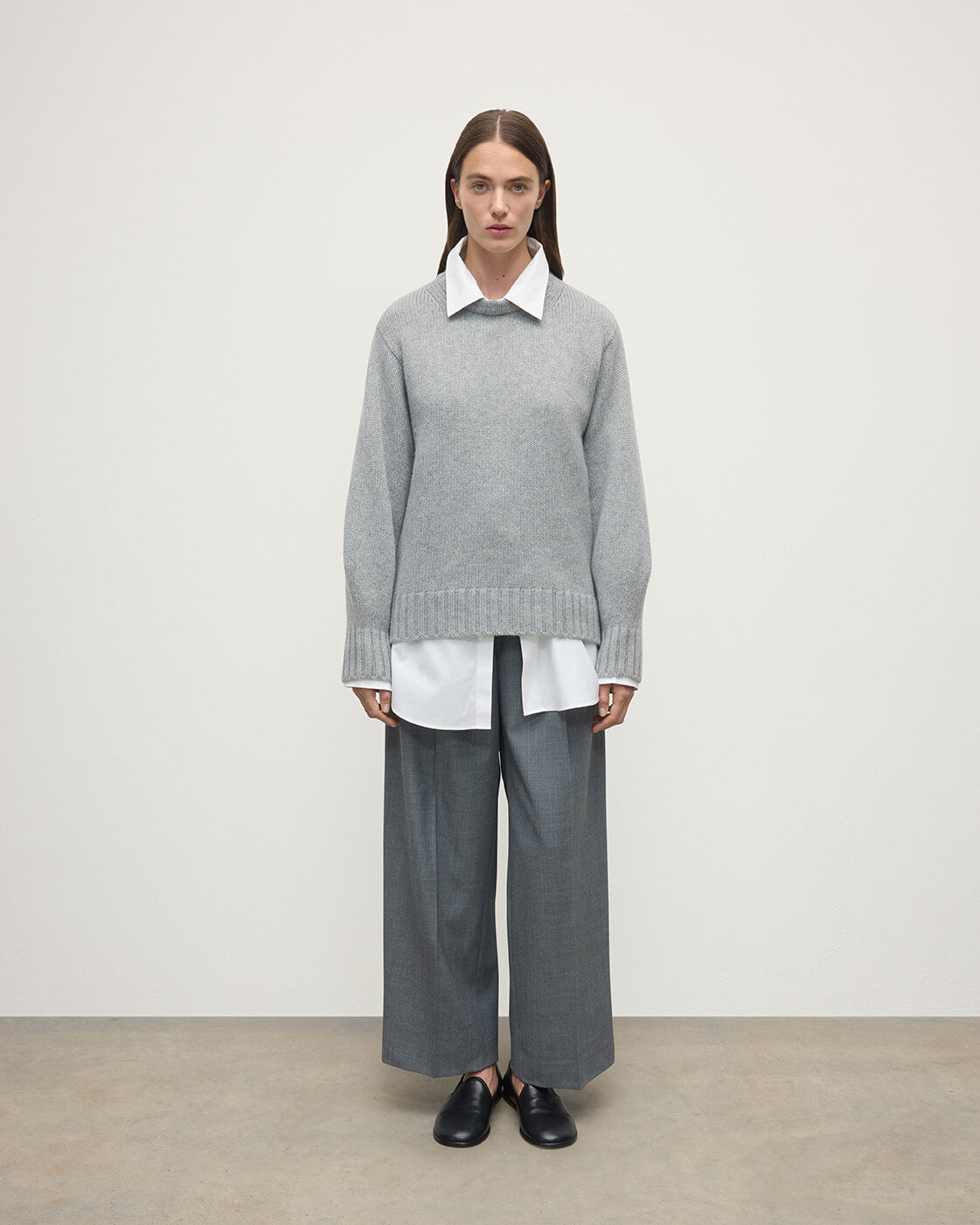 Model wearing Johnstons of Elgin AW25 Women's Knitwear Light Grey Relaxed Grey Cashmere Jumper Front View KAB05562HA0308
