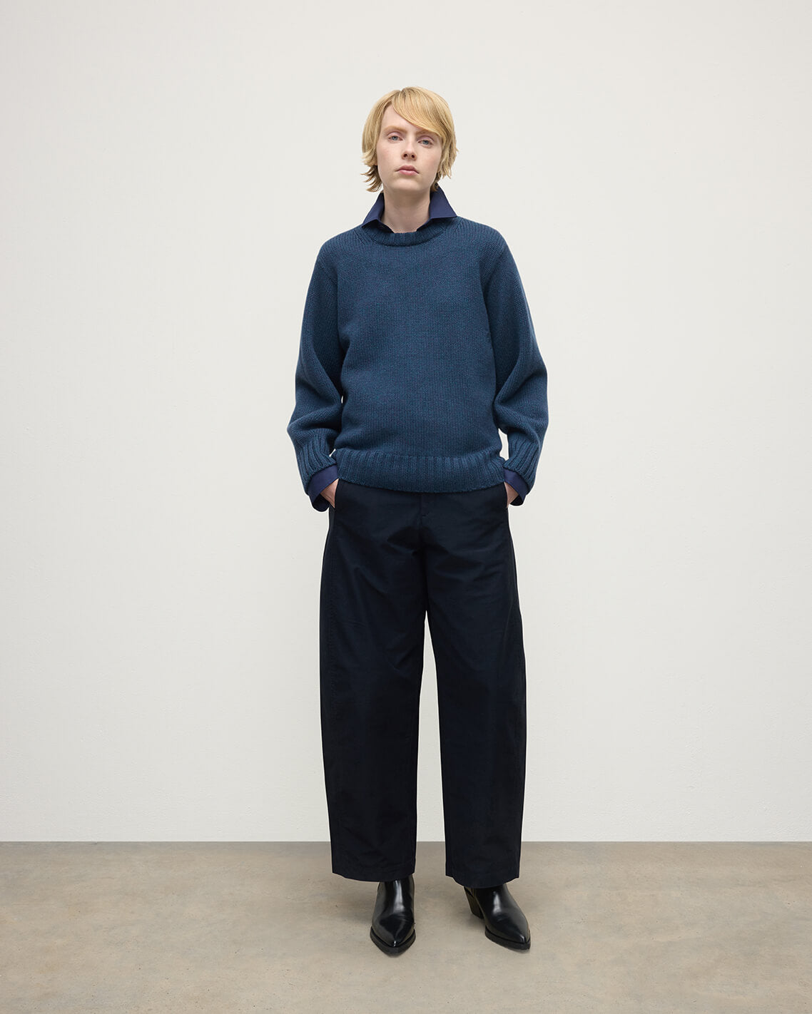 Model wearing Johnstons of Elgin AW25 Women's Knitwear Heather Navy Relaxed Navy Cashmere Jumper Front View KAB05562HD7321