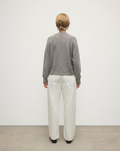 Model wearing Johnstons of Elgin AW25 Women's Knitwear Peregrine Donegal Donegal Cashmere Grey V Neck Cardigan Back View KAC05090006335