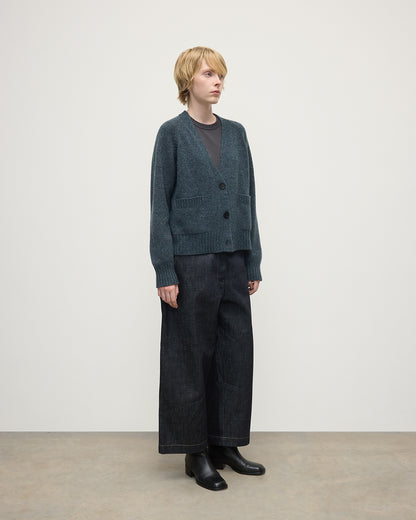 Model wearing Johnstons of Elgin AW25 Women's Knitwear Storm Donegal Donegal Cashmere Blue V Neck Cardigan Side View KAC05090006336