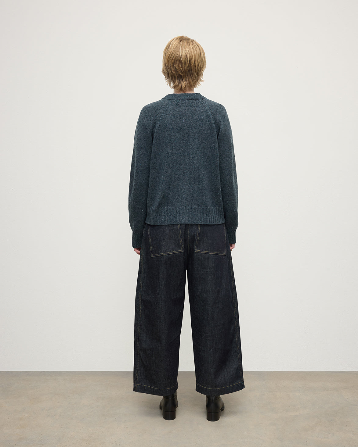 Model wearing Johnstons of Elgin AW25 Women's Knitwear Storm Donegal Donegal Cashmere Blue V Neck Cardigan Back View KAC05090006336