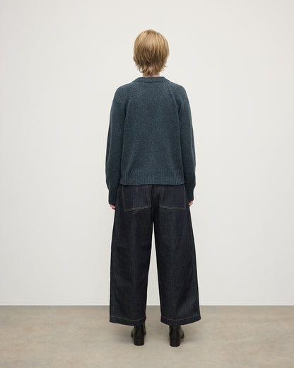 Model wearing Johnstons of Elgin AW25 Women's Knitwear Storm Donegal Donegal Cashmere Blue V Neck Cardigan Back View KAC05090006336