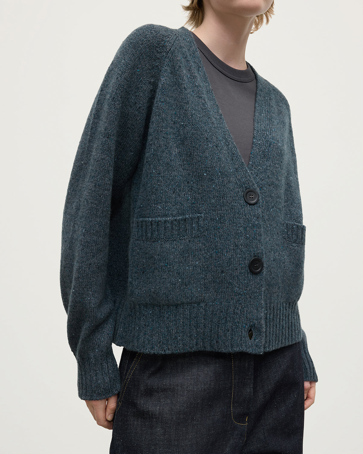 Model wearing Johnstons of Elgin AW25 Women's Knitwear Storm Donegal Donegal Cashmere Blue V Neck Cardigan close up KAC05090006336