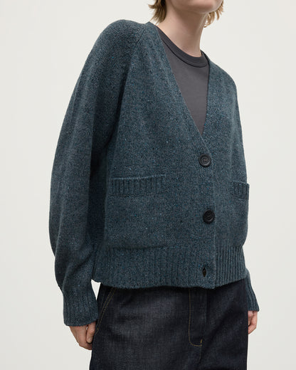 Model wearing Johnstons of Elgin AW25 Women's Knitwear Storm Donegal Donegal Cashmere Blue V Neck Cardigan close up KAC05090006336
