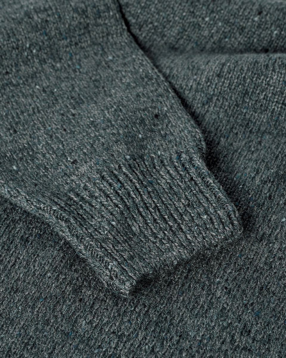 Close up view of a model wearing Johnstons of Elgin AW25 Men's Knitwear Storm Donegal Donegal Cashmere Marl Jumper KAC05287006336