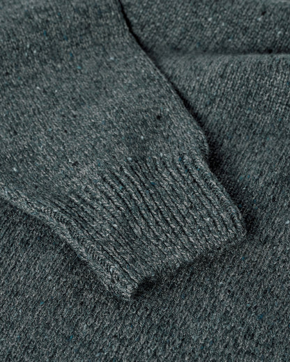 Close up view of a model wearing Johnstons of Elgin AW25 Men's Knitwear Storm Donegal Donegal Cashmere Marl Jumper KAC05287006336