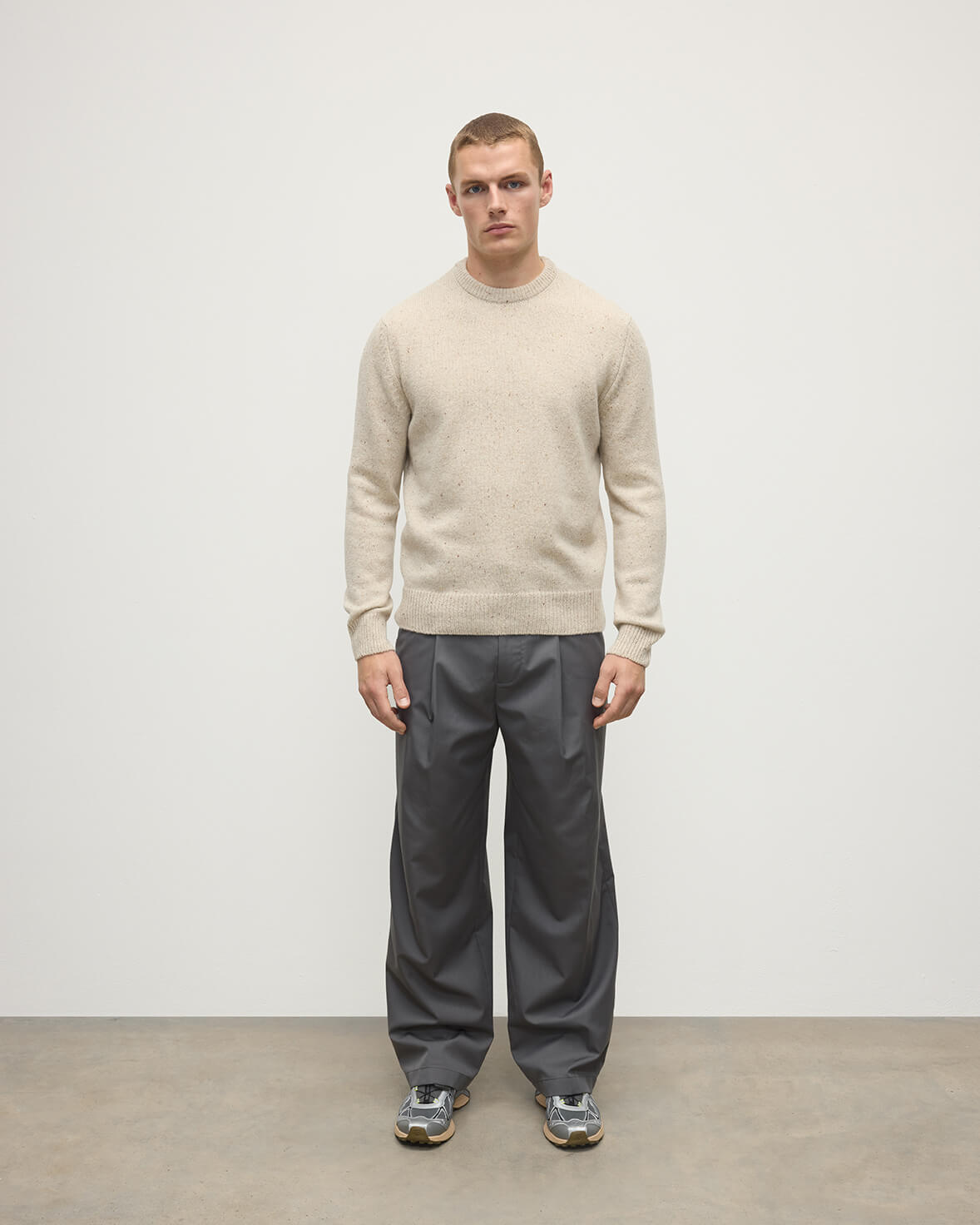 Model wears Johnstons of Elgin AW25 Men's Knitwear Cream Dun Donegal Cream Donegal Cashmere Marl Jumper Front KAC05287006334