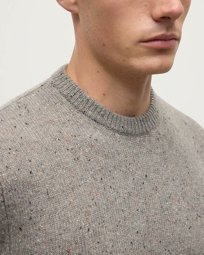 Model wearing Johnstons of Elgin AW25 Men's Knitwear Peregrine Donegal Grey Donegal Cashmere Marl Jumper Details KAC05287006335