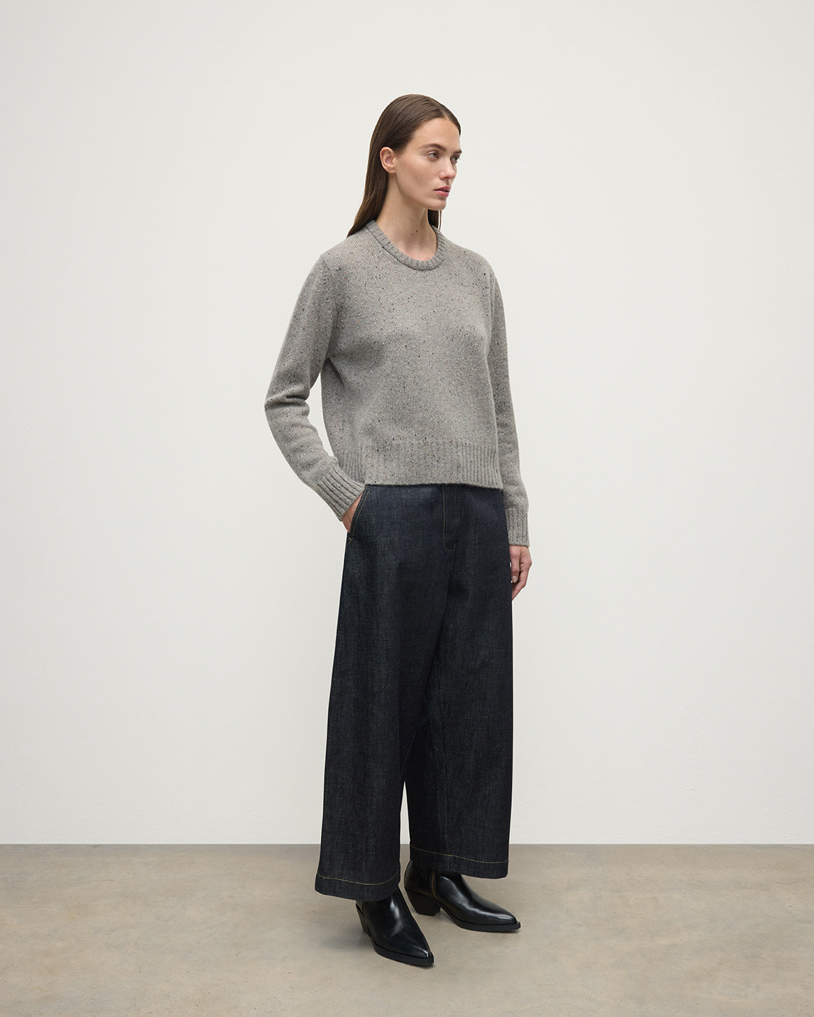 Model wearing Johnstons of Elgin AW25 Women's Knitwear Peregrine Donegal Donegal Cashmere Grey Jumper Side View KAC05289006335