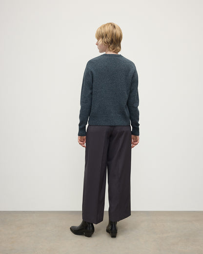 Model wearing Johnstons of Elgin AW25 Women's Knitwear Storm Donegal Donegal Cashmere Blue Cardigan Back View KAC05494006336