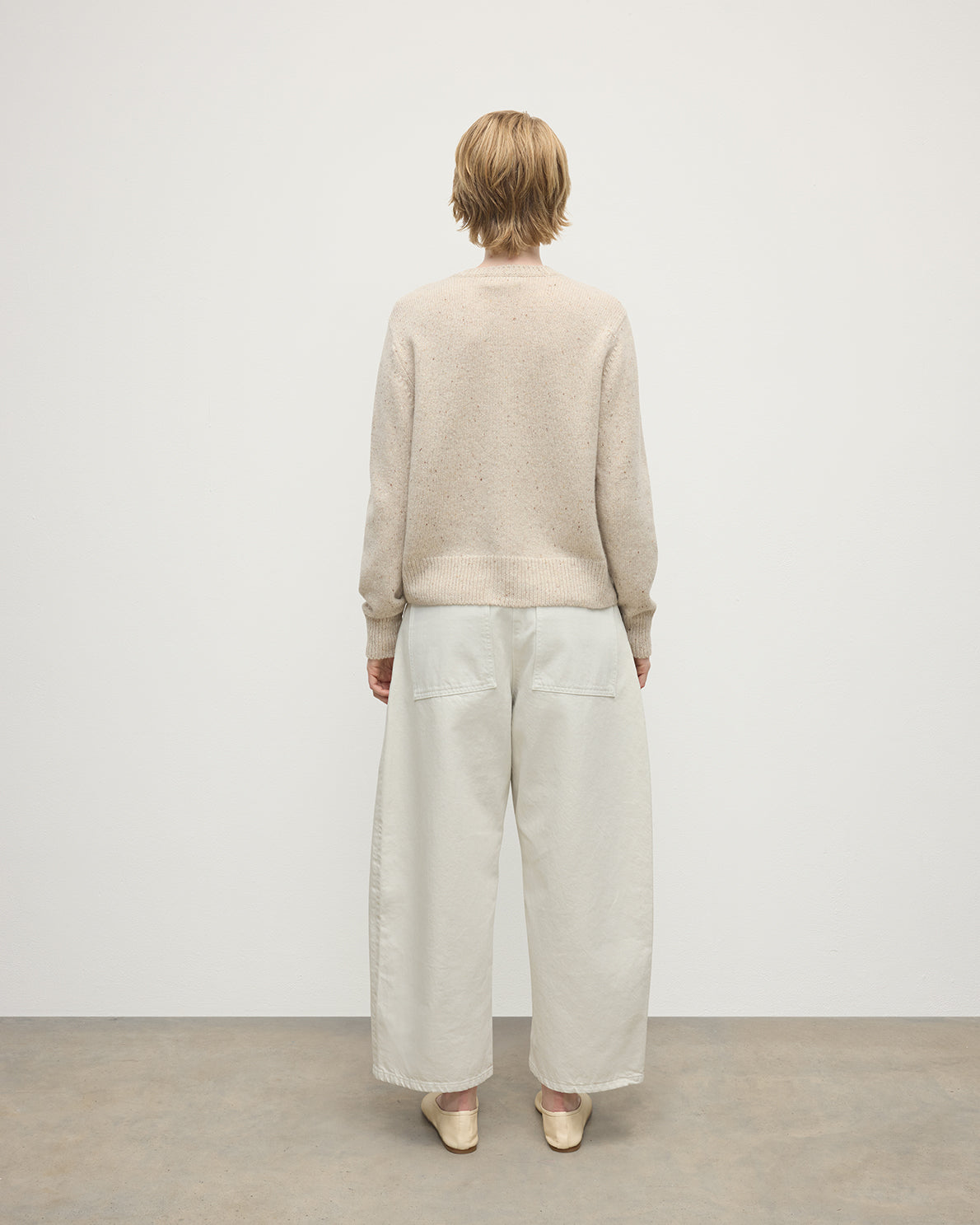 Model wearing Johnstons of Elgin AW25 Women's Knitwear Cream Dun Donegal Donegal Cashmere Cream Cardigan Back View KAC05494006334
