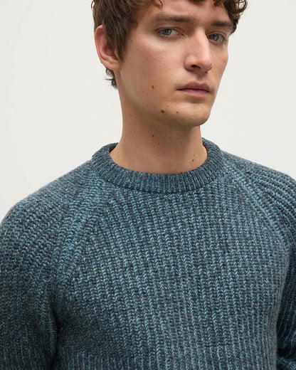 Model wears Johnstons of Elgin AW25 Men's Knitwear Storm Donegal & Seascape Ribbed Donegal Cashmere Blue Jumper Details  KAC05581Q25392