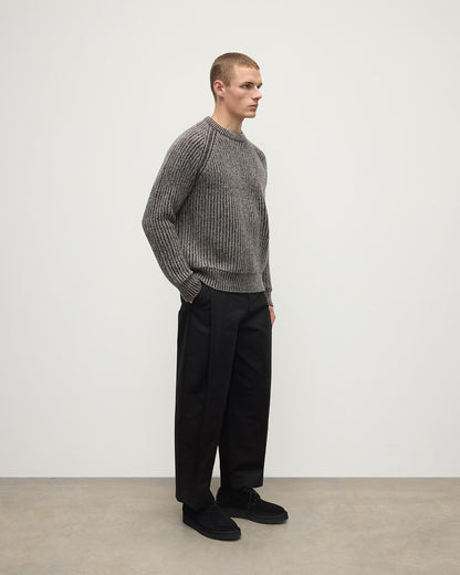 Model wearing Johnstons of Elgin AW25 Men's Knitwear Peregrine Donegal & Molasses Ribbed Donegal Cashmere Grey Jumper Side KAC05581Q25393