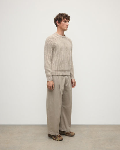 Side view of a model wearing Johnstons of Elgin AW25 Men's Knitwear Cream Dun Donegal & Ash Ribbed Donegal Cashmere Cream Jumper KAC05581Q25394