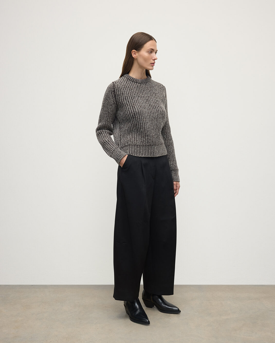 Model wearing Johnstons of Elgin AW25 Women's Knitwear Peregrine Donegal & Molasses High Neck Donegal Cashmere Brown Jumper Side View KAC05590Q25393